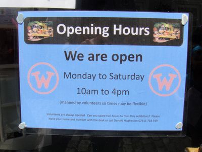 Opening hours sign for the exhibition