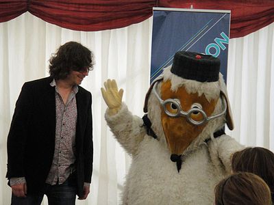 Great Uncle Bulgaria waves to the audience