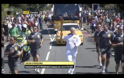 Dean Parsons carries the Olympic Torch