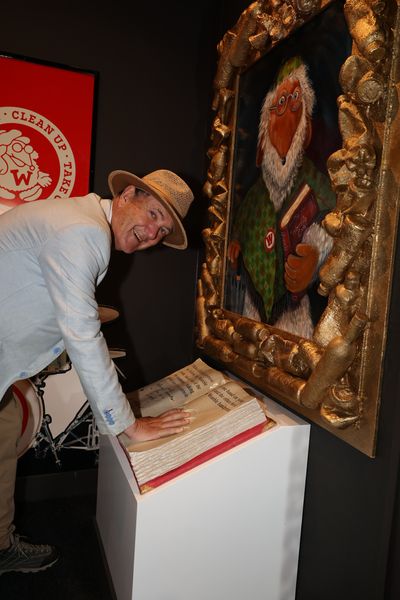 Marcus takes the pledge with his hand in the Womble handprint