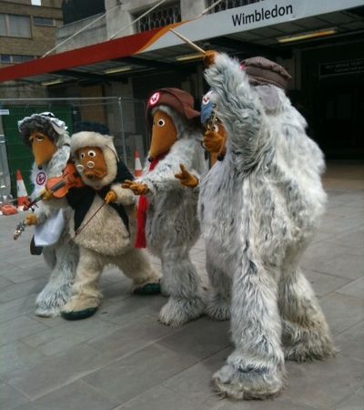 The Wombles band posing outside Wimbledon train station