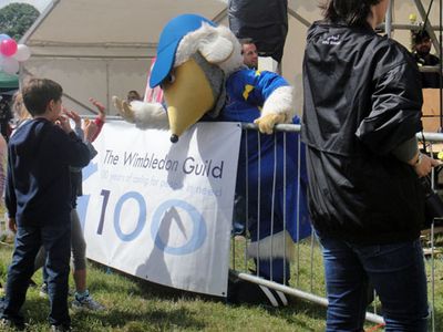 Haydon the Womble high-fives the kids